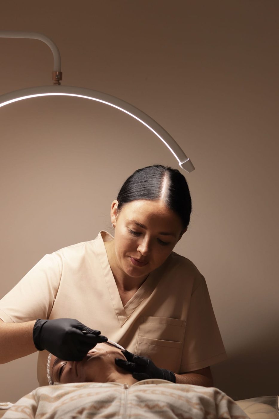 Leanne carrying out a treatment in clinic